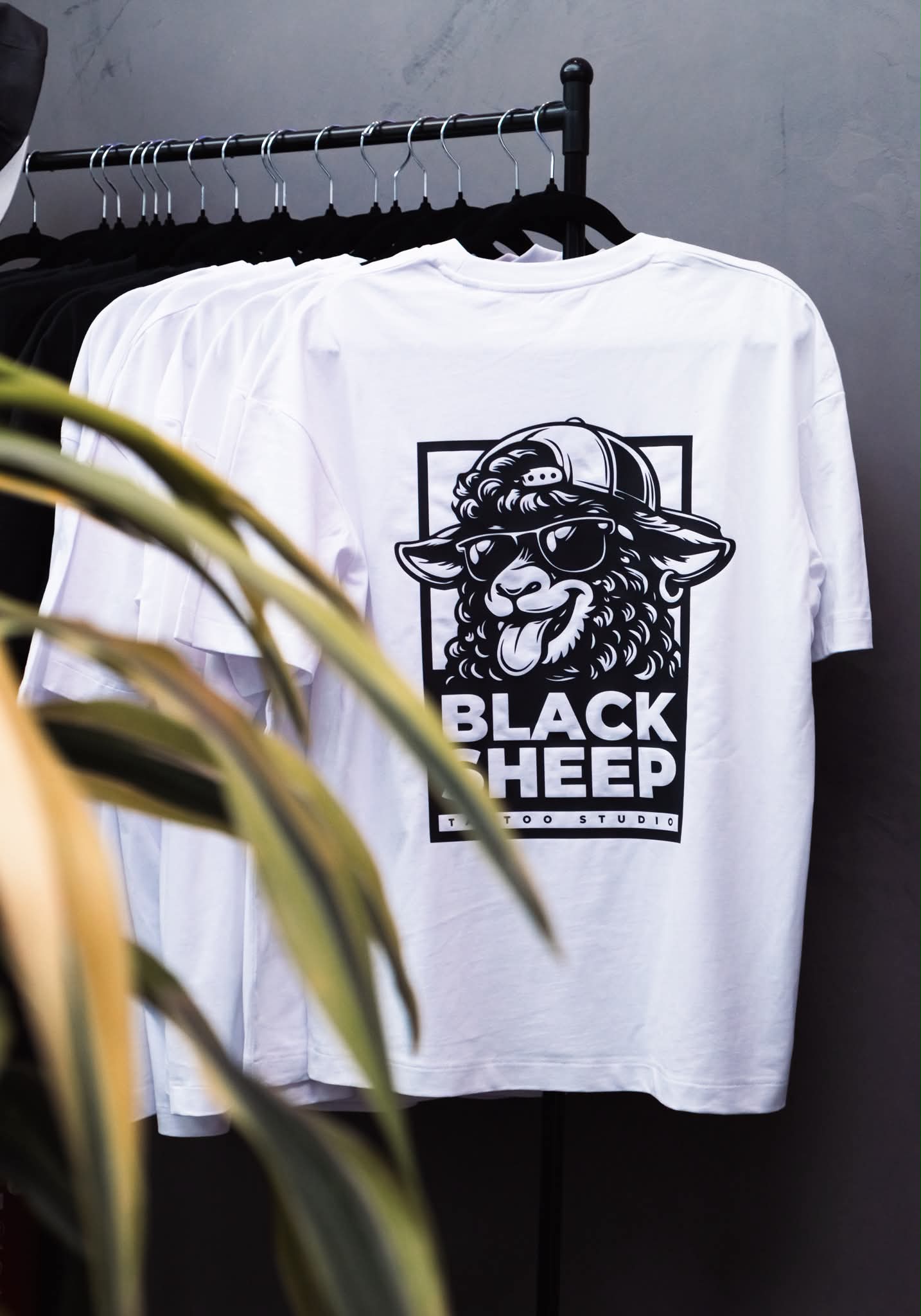 Black Sheep Tattoo Studio merchandise and T-shirts displayed inside the Kos studio
